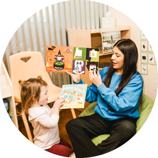Teacher and child reading.